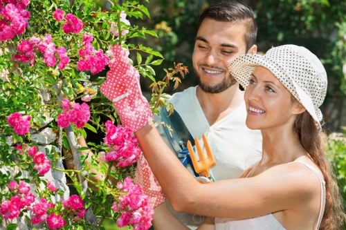 Gardening team preparing lawn mower before cutting